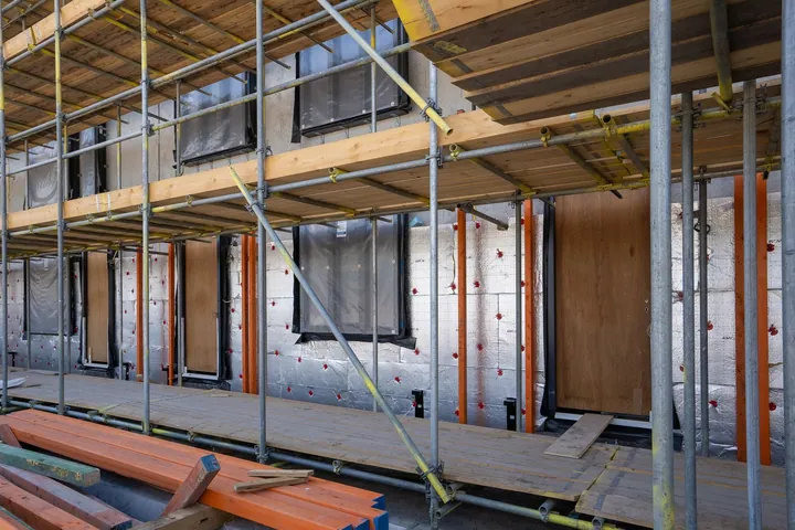 Scaffolding around the outside of a building under construction
